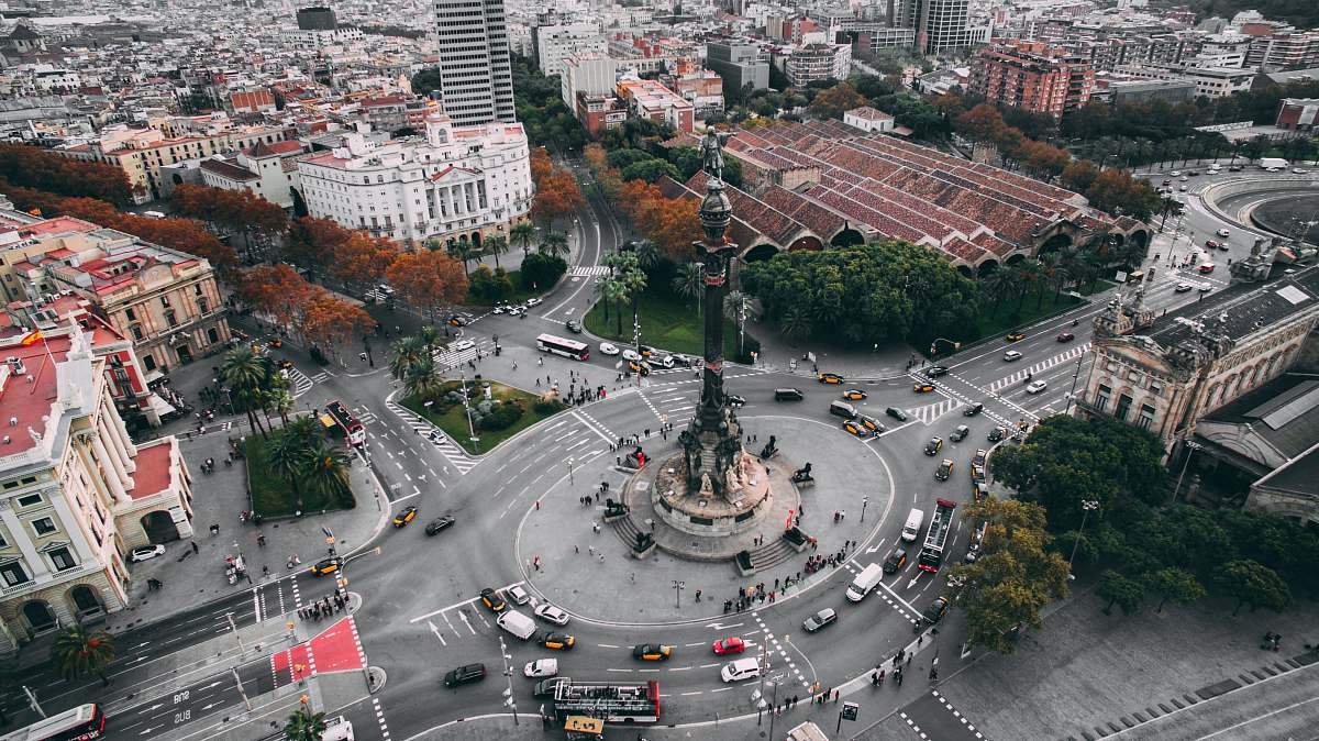 aerial view bird's eye view of white and brown concrete high-rise building intersection